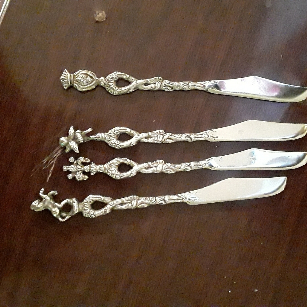Very old set of silver butter knives.